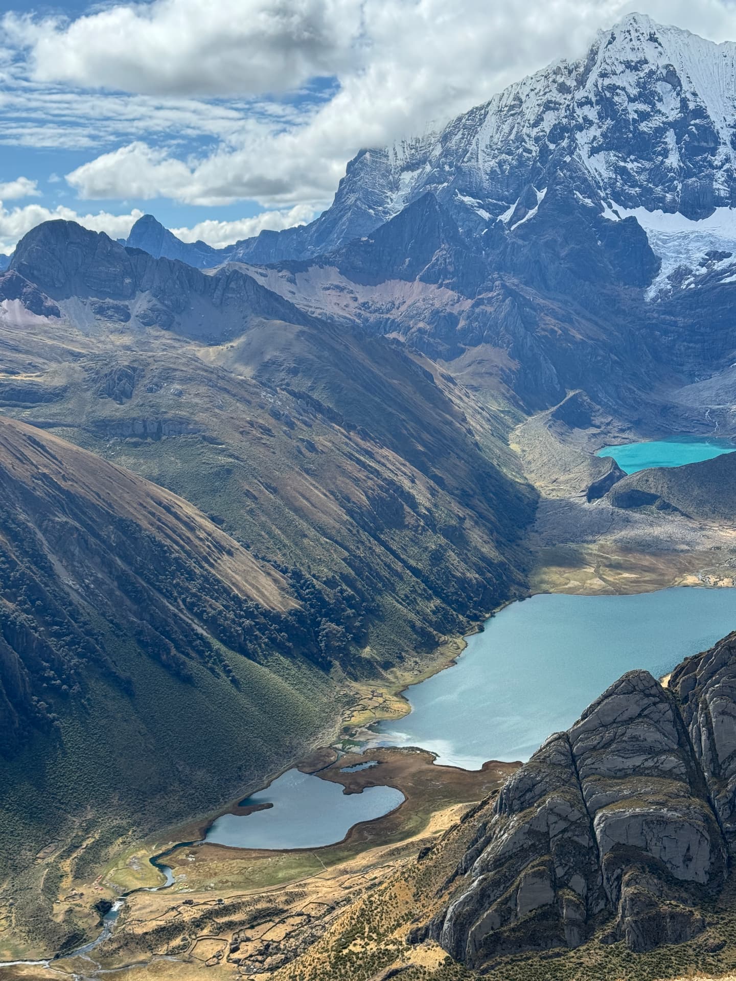Turquoise lakes beneath snow-covered peaks