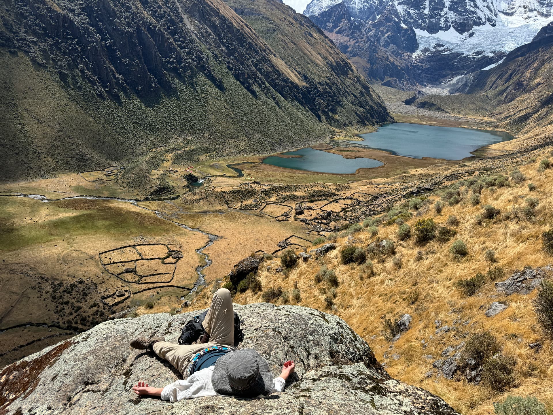 Resting on a rock above mountain lakes